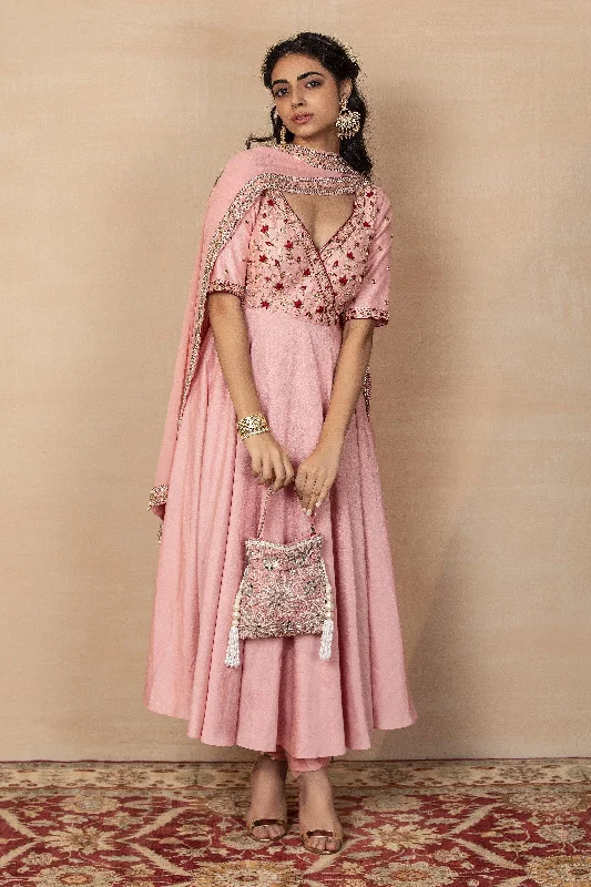 Statement dresses for making a fashion statementDesigner Rashika's Light Pink Silk Anarkali Churidar Suit with Dupatta for Rent