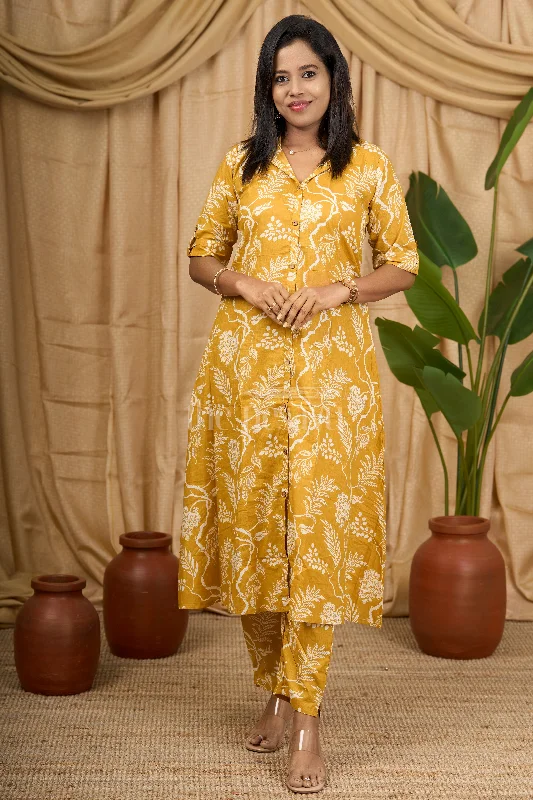Low-cut dresses for womenNesavu Mustard Yellow Cotton Flared Kurtha with White Botanical Print for Casual and Festive Wear