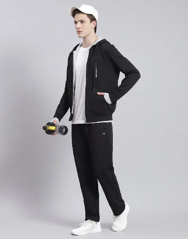 men's sports shirts with thumbholesMen Black Solid Hooded Full Sleeve Tracksuit