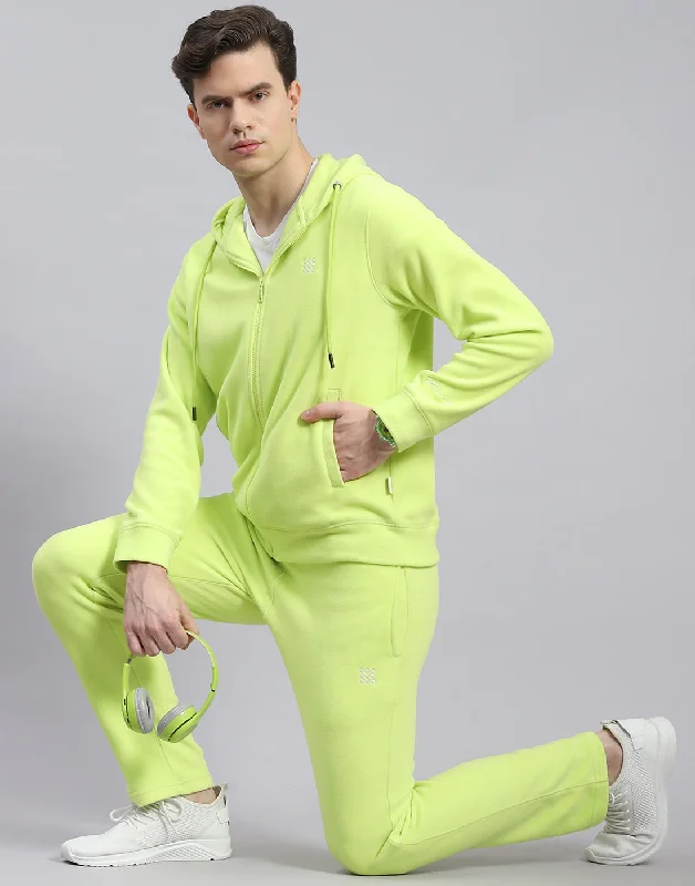 men's performance wear shirtsMen Green Solid Hooded Full Sleeve Tracksuit